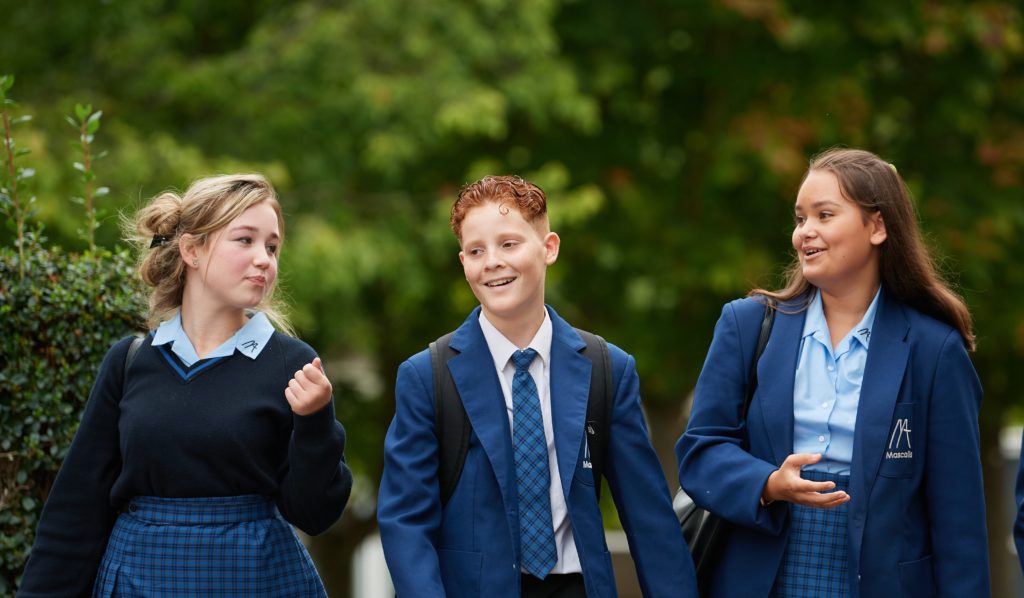 Students smiling and walking