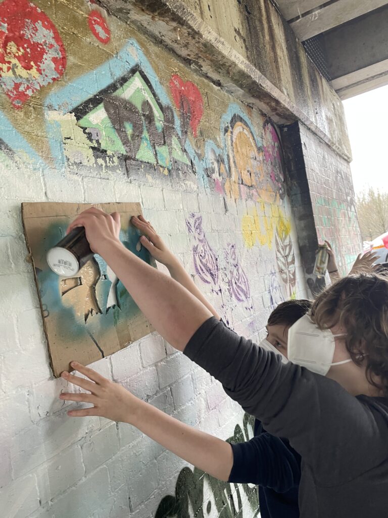 Students partaking in street art