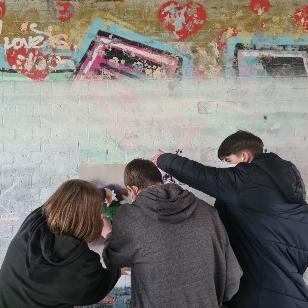Students partaking in street art