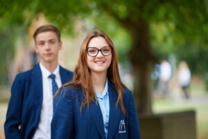 Student stood in front of another student
