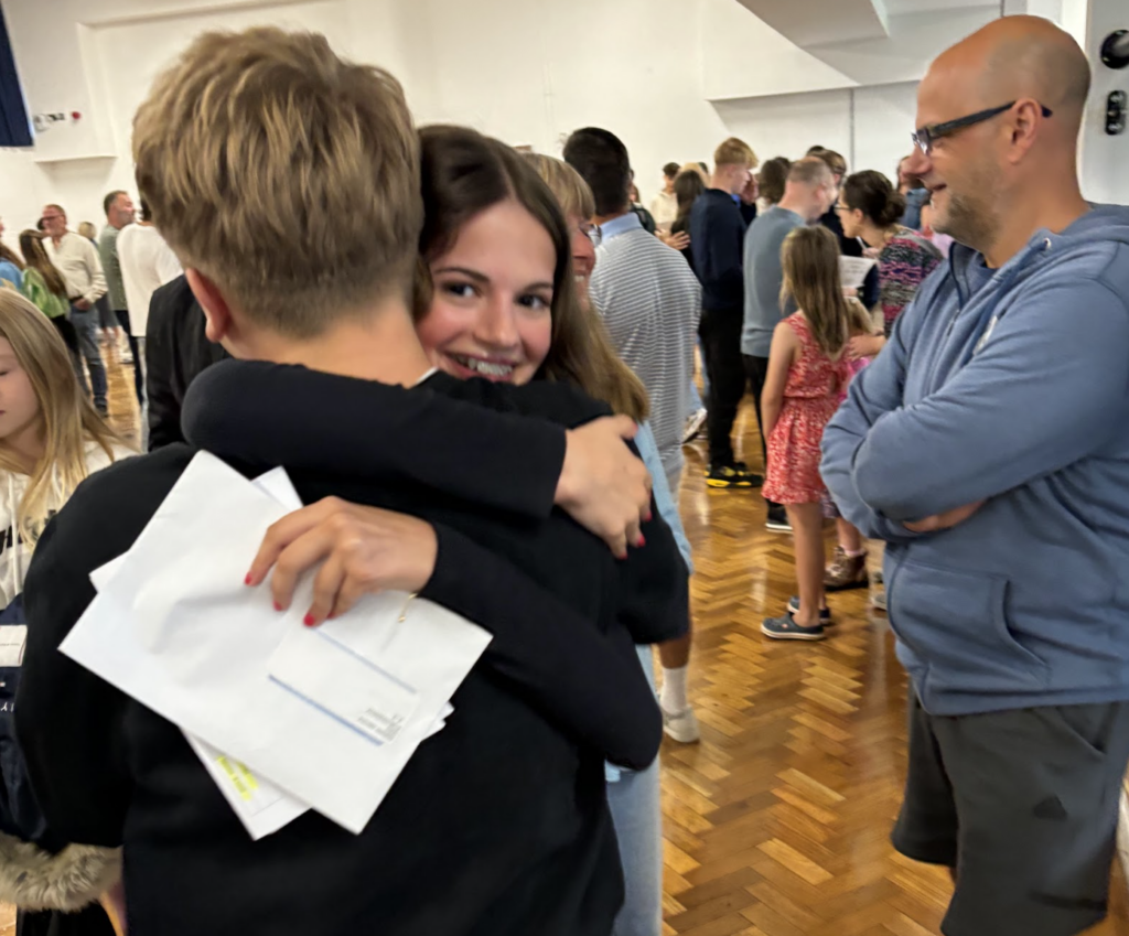 Students holding their results